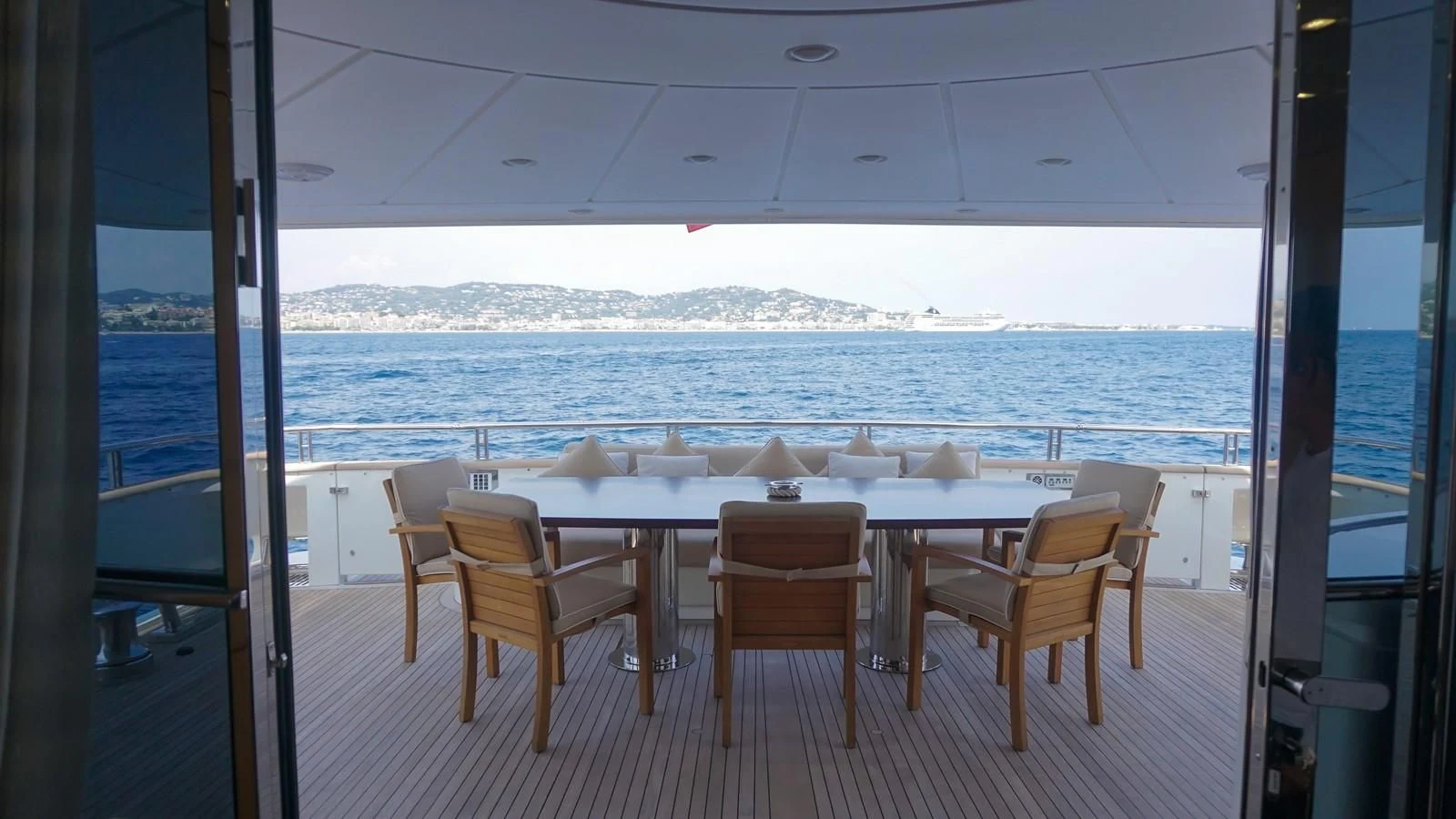 a room with a table and chairs aboard PETRUS Yacht for Sale