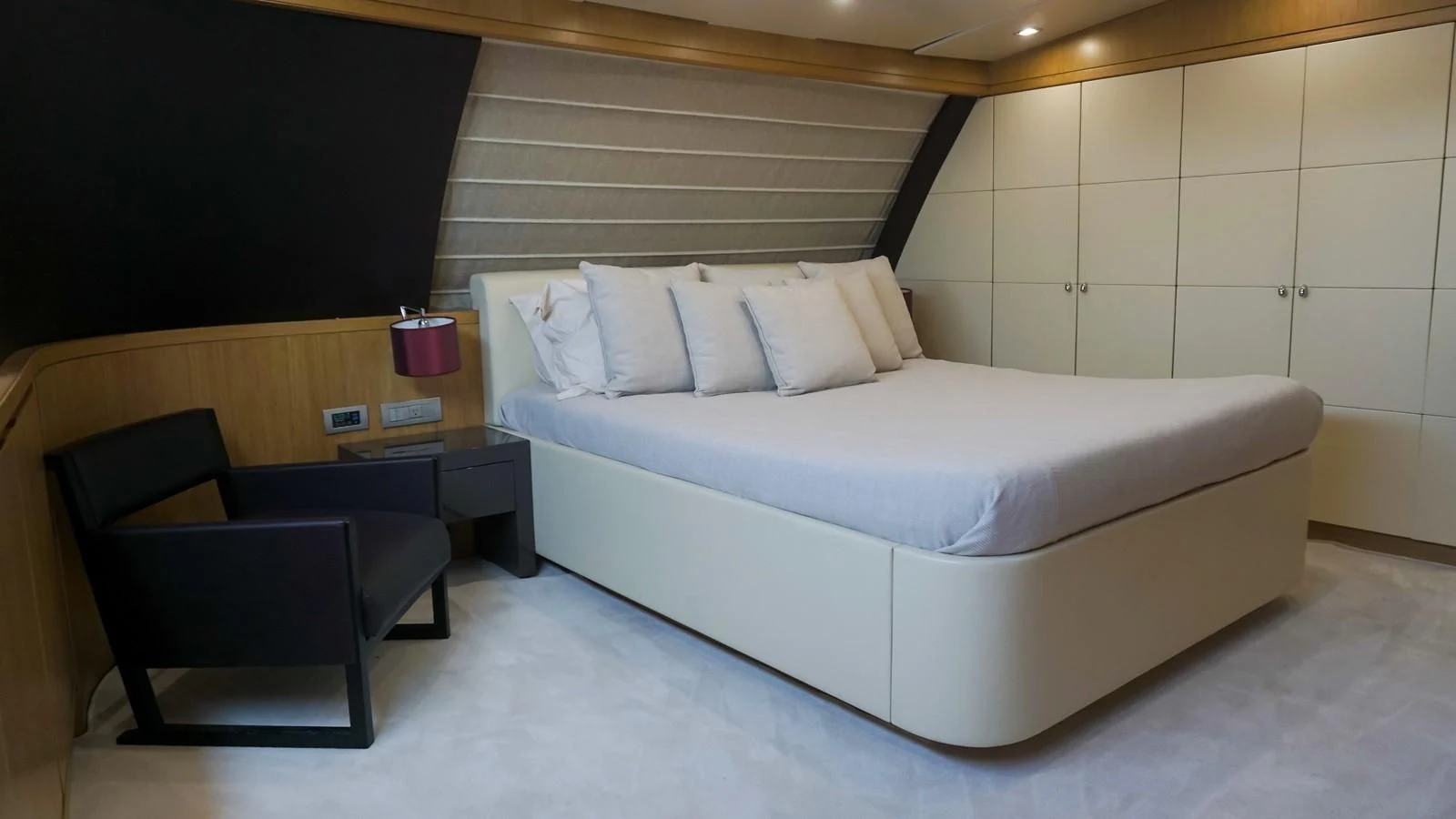 a bed with a white bed aboard PETRUS Yacht for Sale