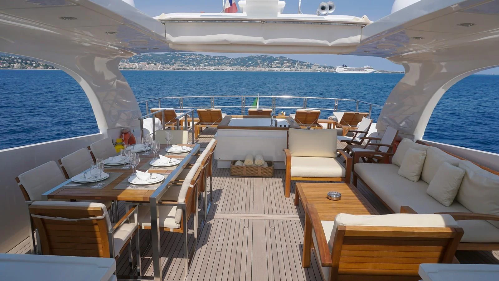 a room with a table chairs and a pool aboard PETRUS Yacht for Sale