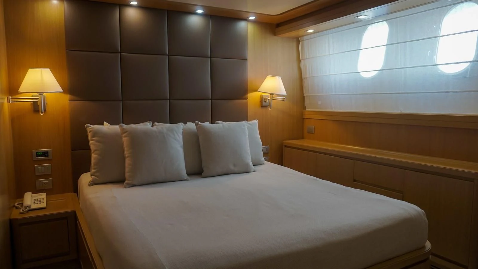 a bed with white pillows aboard PETRUS Yacht for Sale