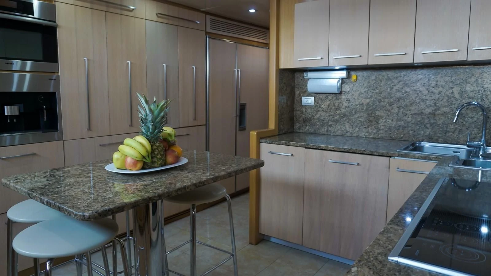 a bowl of fruit on a table aboard PETRUS Yacht for Sale