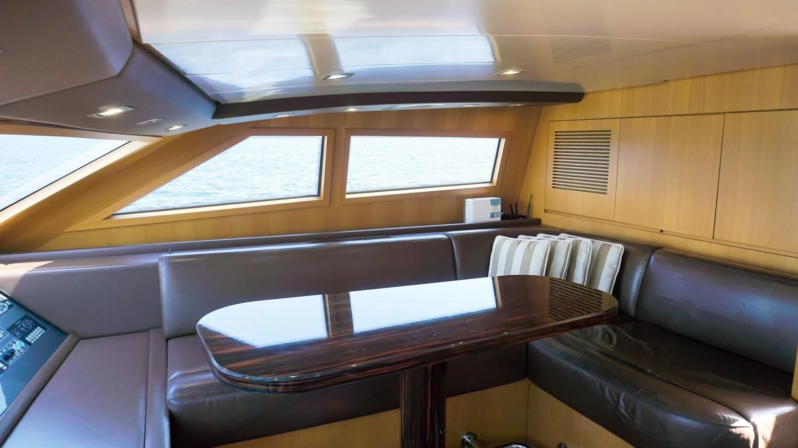 a room with a couch and a table aboard PETRUS Yacht for Sale