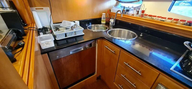 a kitchen with a sink and countertop aboard CELINE Yacht for Sale