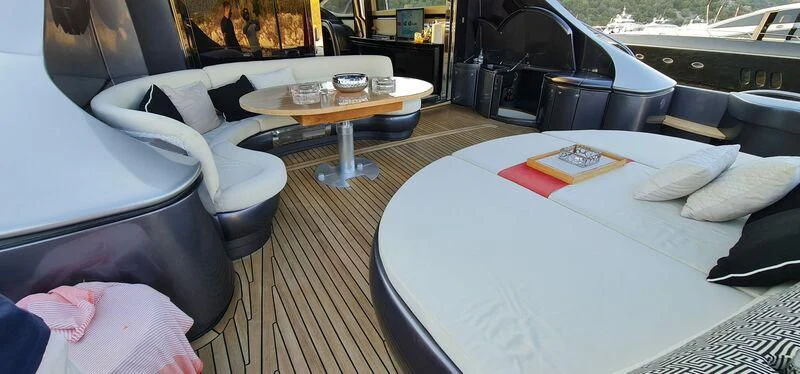 a room with a couch and a table and chairs aboard CELINE Yacht for Sale
