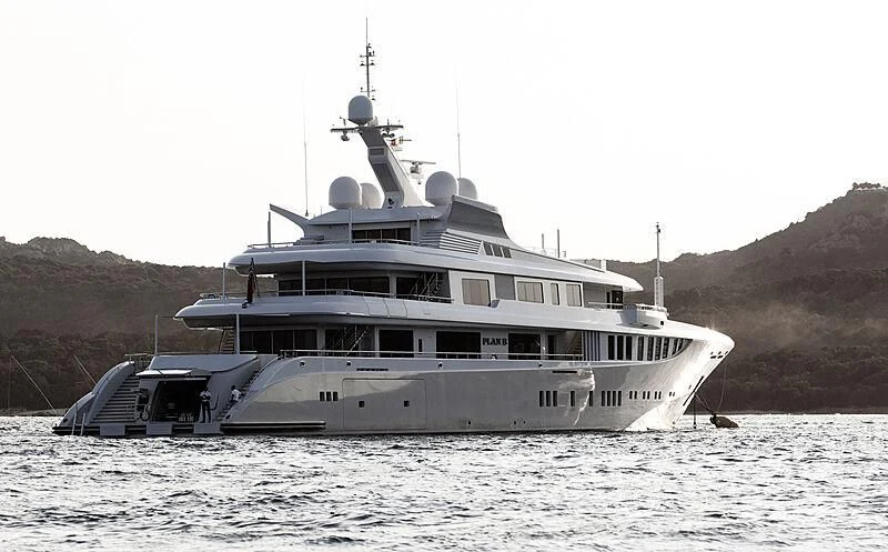 a large boat in the water aboard PLAN B Yacht for Sale