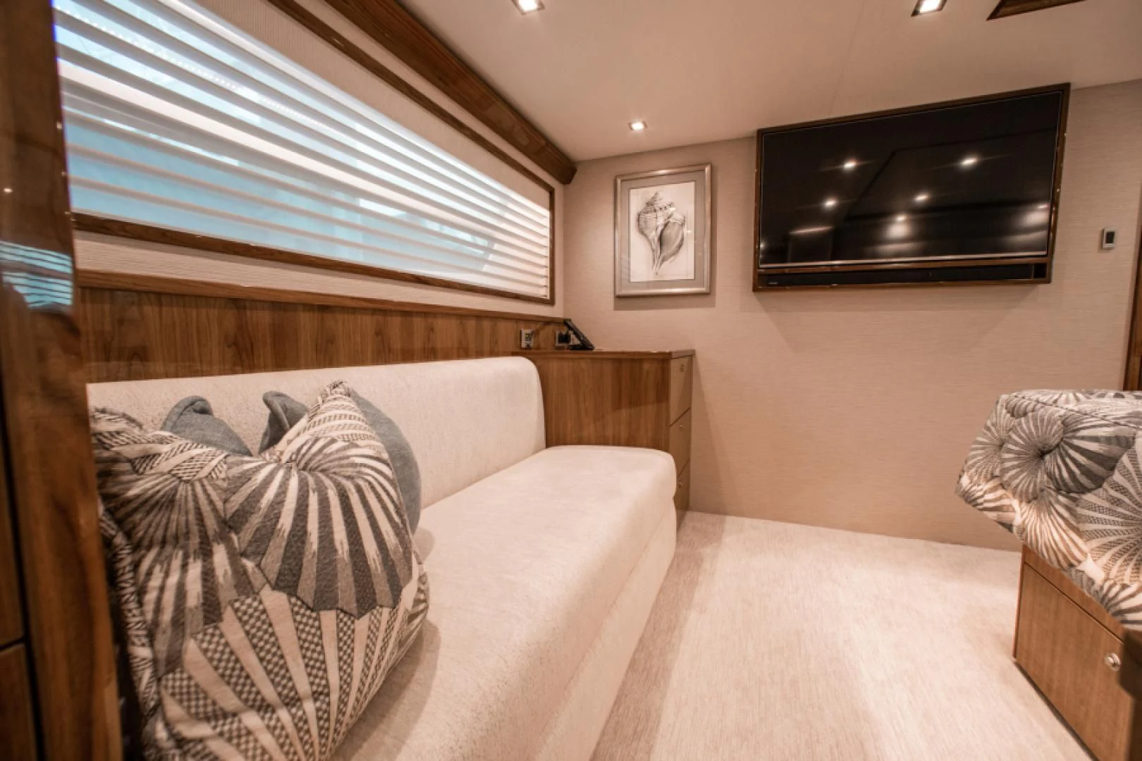 a living room with a couch and a television aboard MANA Yacht for Sale