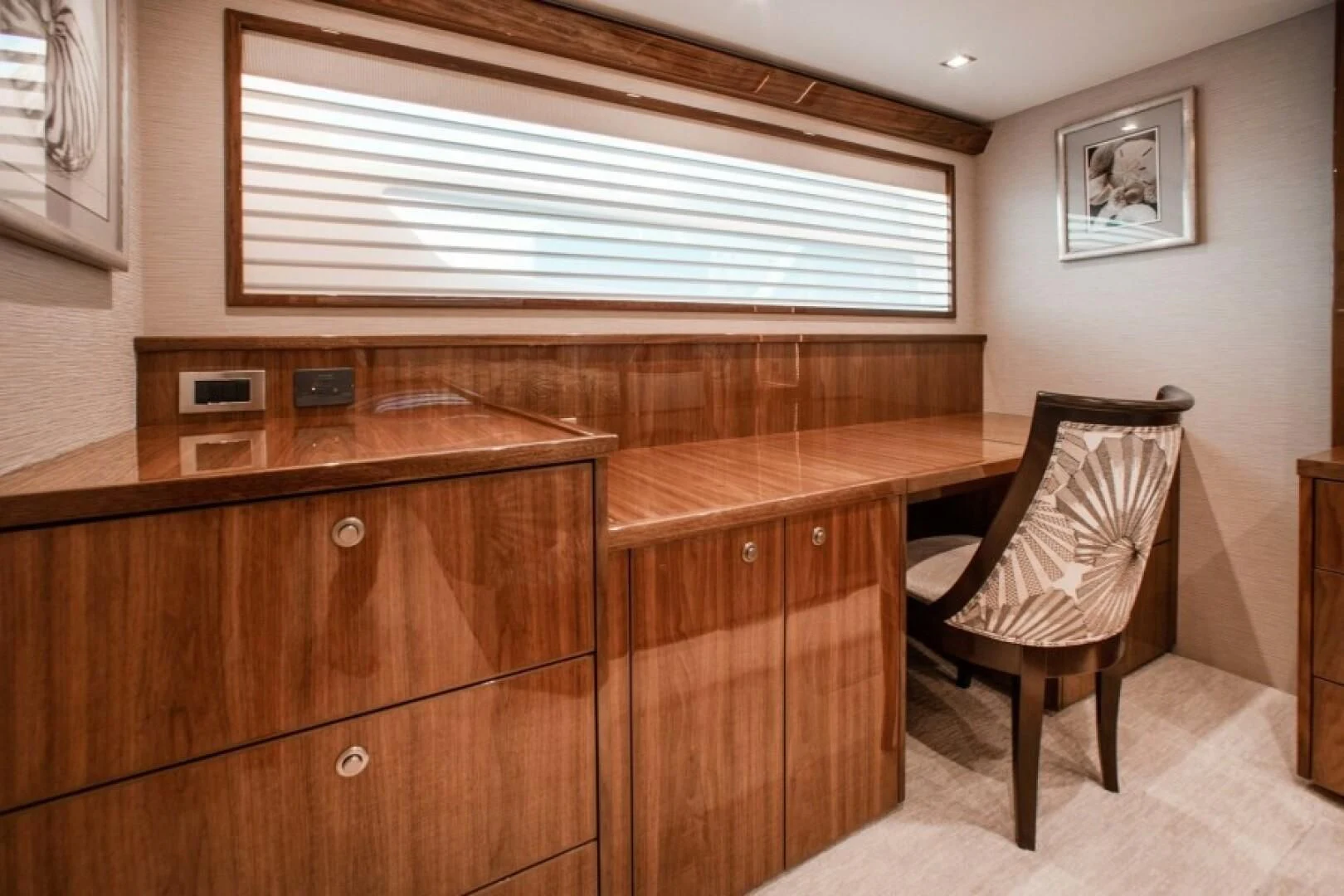 a chair and a desk in a room aboard MANA Yacht for Sale