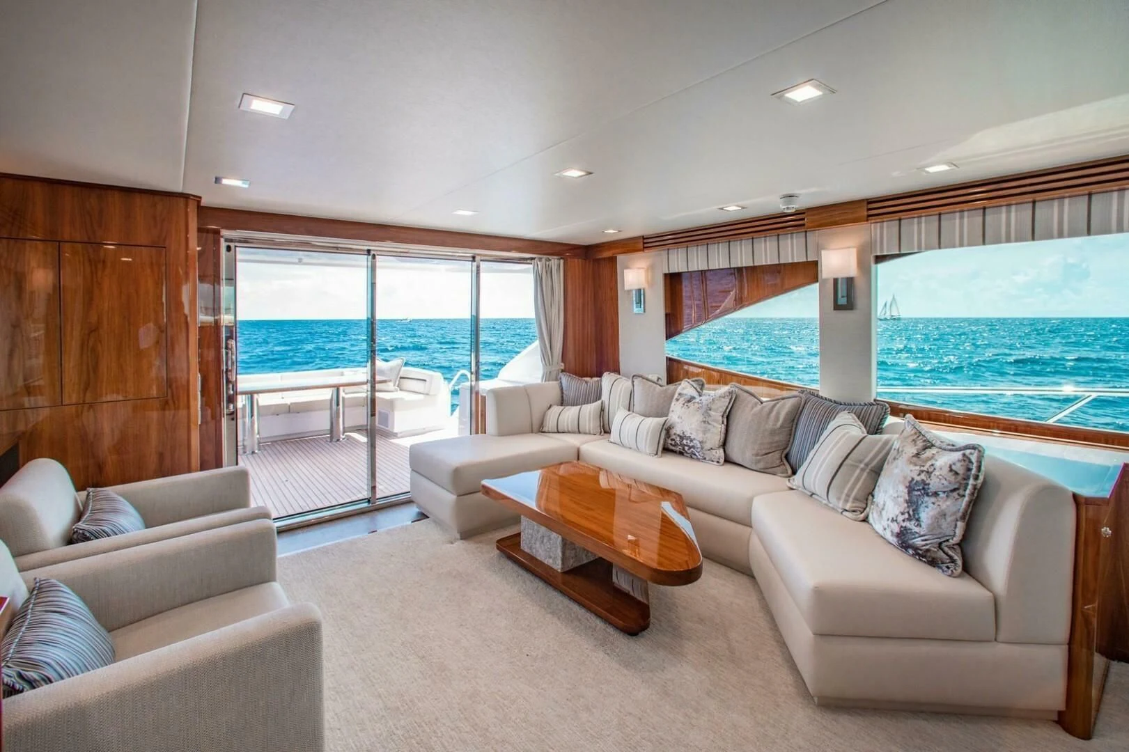 a living room with a large window aboard MANA Yacht for Sale