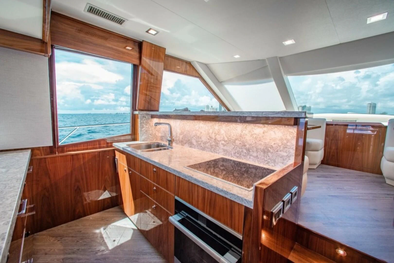 a kitchen with a large island aboard MANA Yacht for Sale