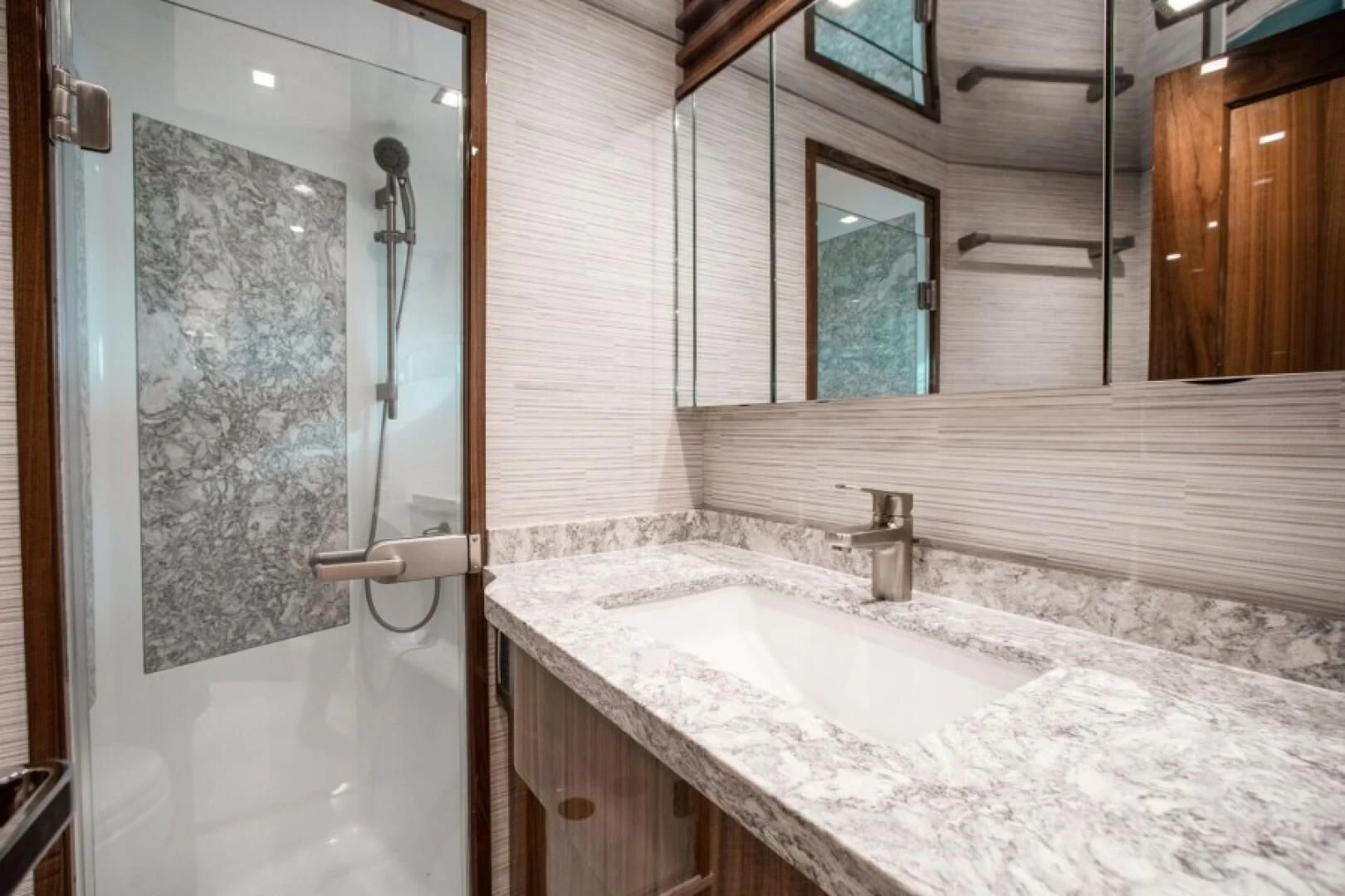a bathroom with a sink and a shower aboard MANA Yacht for Sale