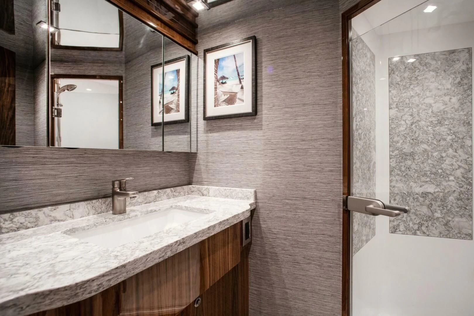a bathroom with a sink and mirror aboard MANA Yacht for Sale