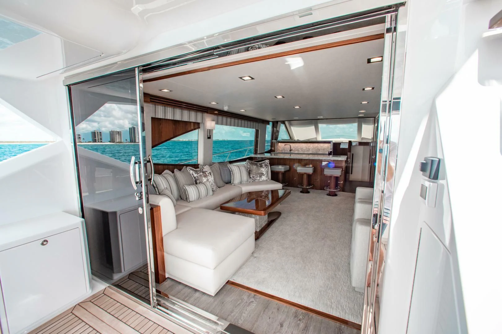 a room with a couch and a table aboard MANA Yacht for Sale