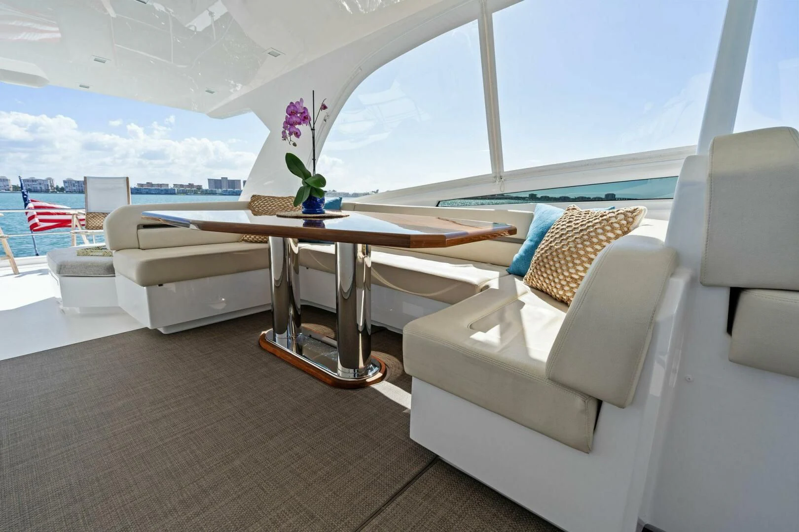 a room with a table and chairs aboard MANA Yacht for Sale