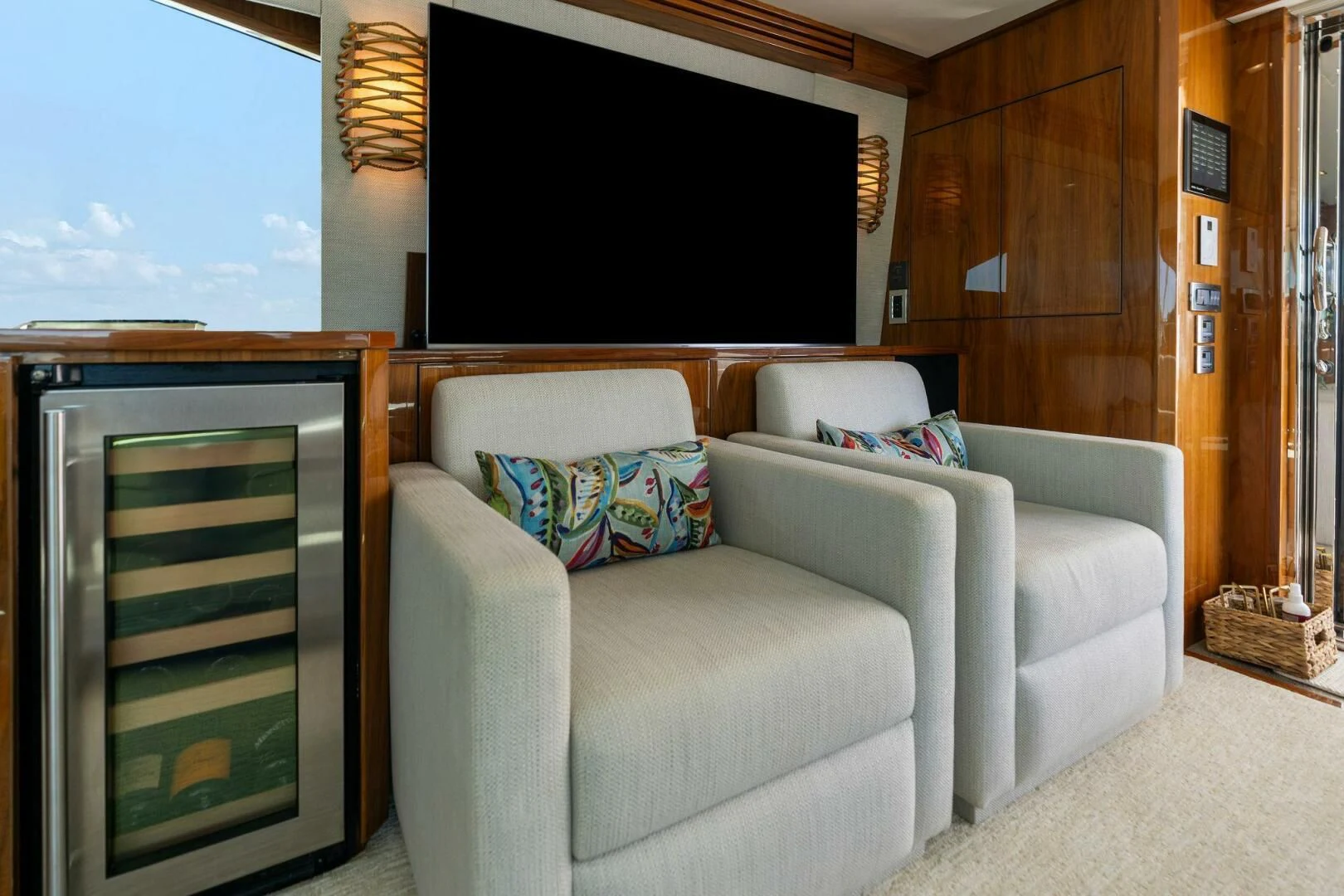 a living room with a couch and a tv aboard MANA Yacht for Sale