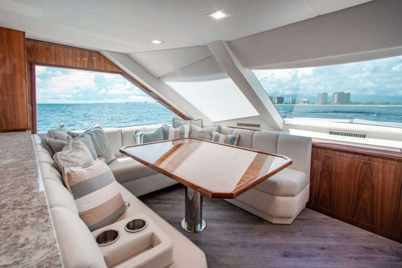 a room with a bed and a table aboard MANA Yacht for Sale