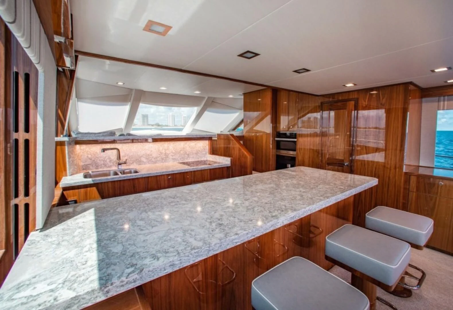 a large kitchen with a large island aboard MANA Yacht for Sale