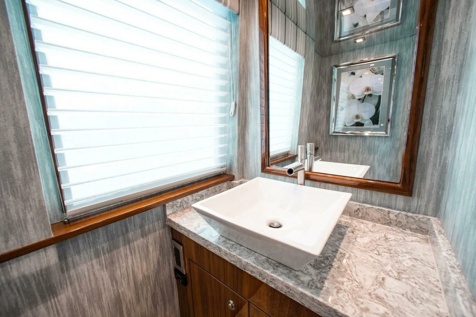 a bathroom with a large mirror aboard MANA Yacht for Sale