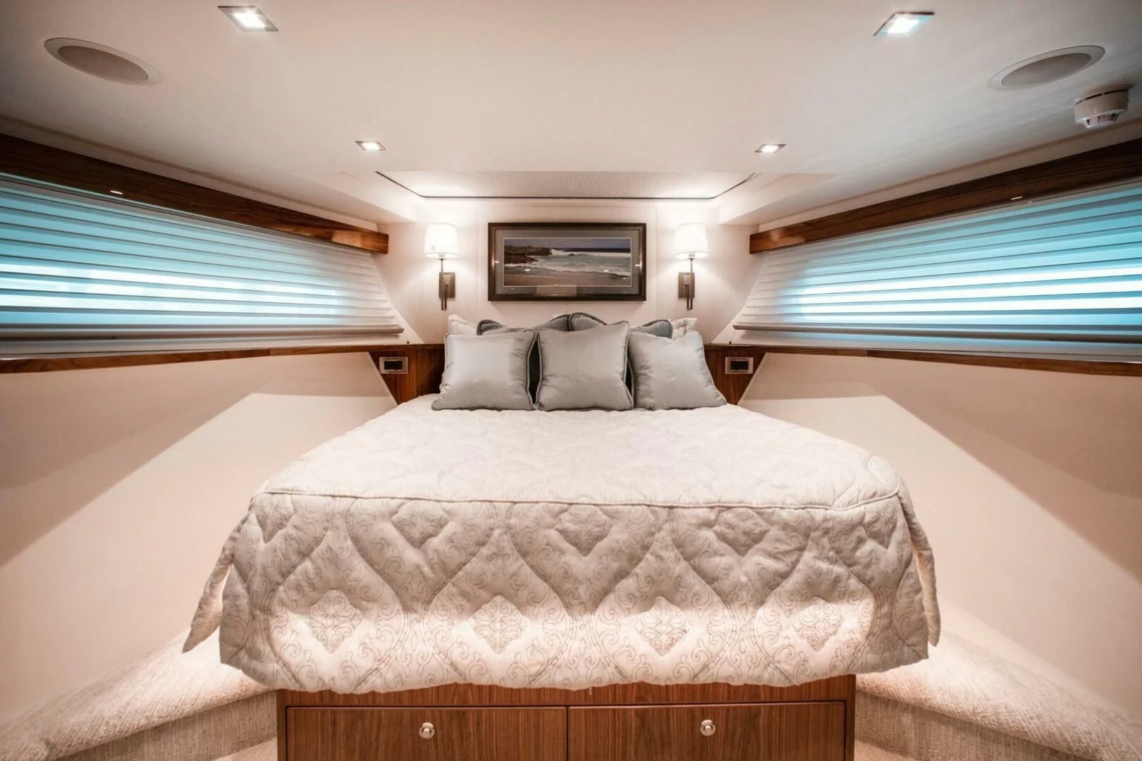 a bedroom with a bed and a window aboard MANA Yacht for Sale