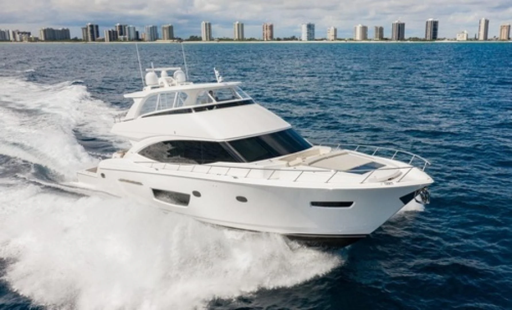 a white yacht in the water aboard MANA Yacht for Sale