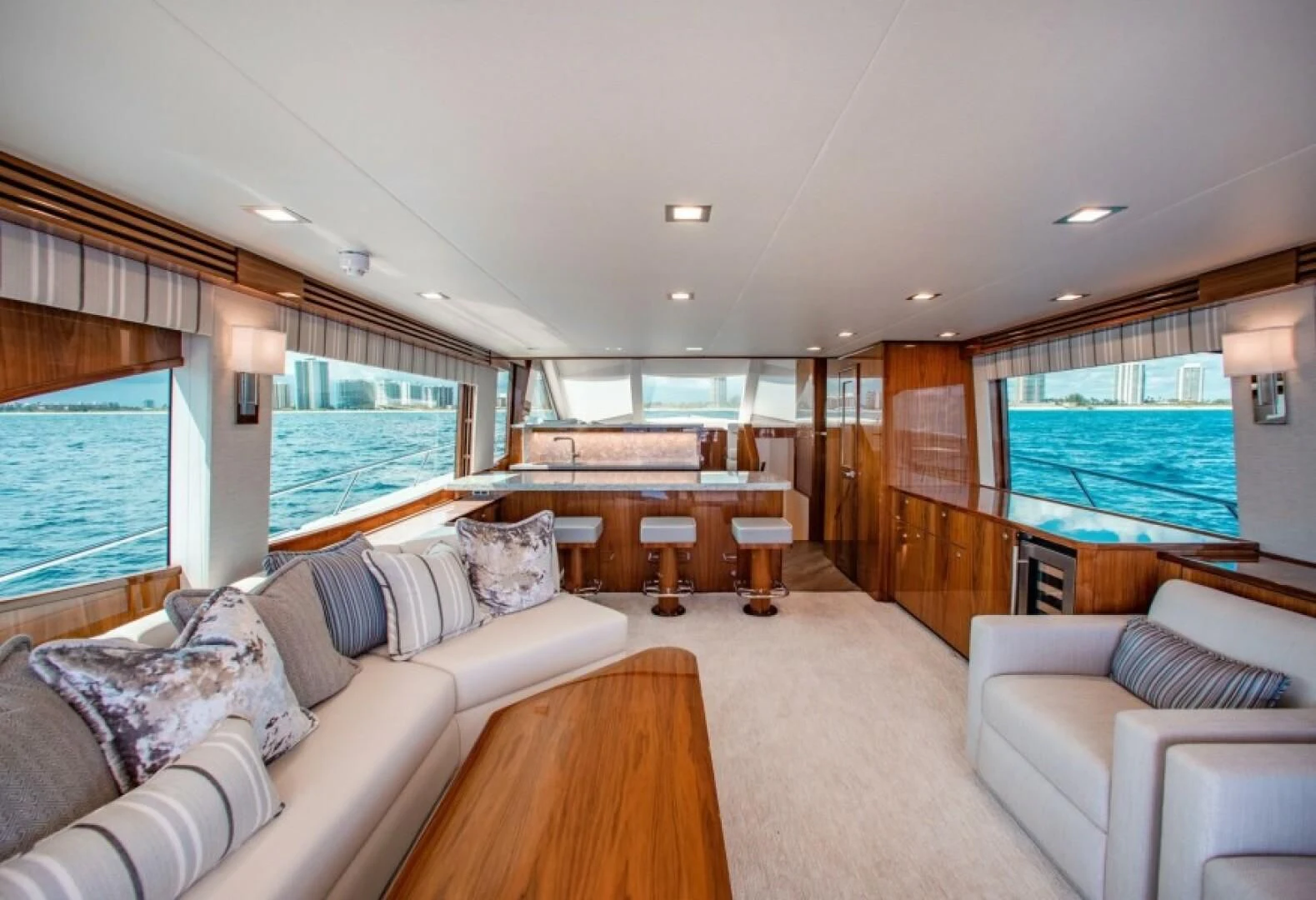 a living room with a large window aboard MANA Yacht for Sale