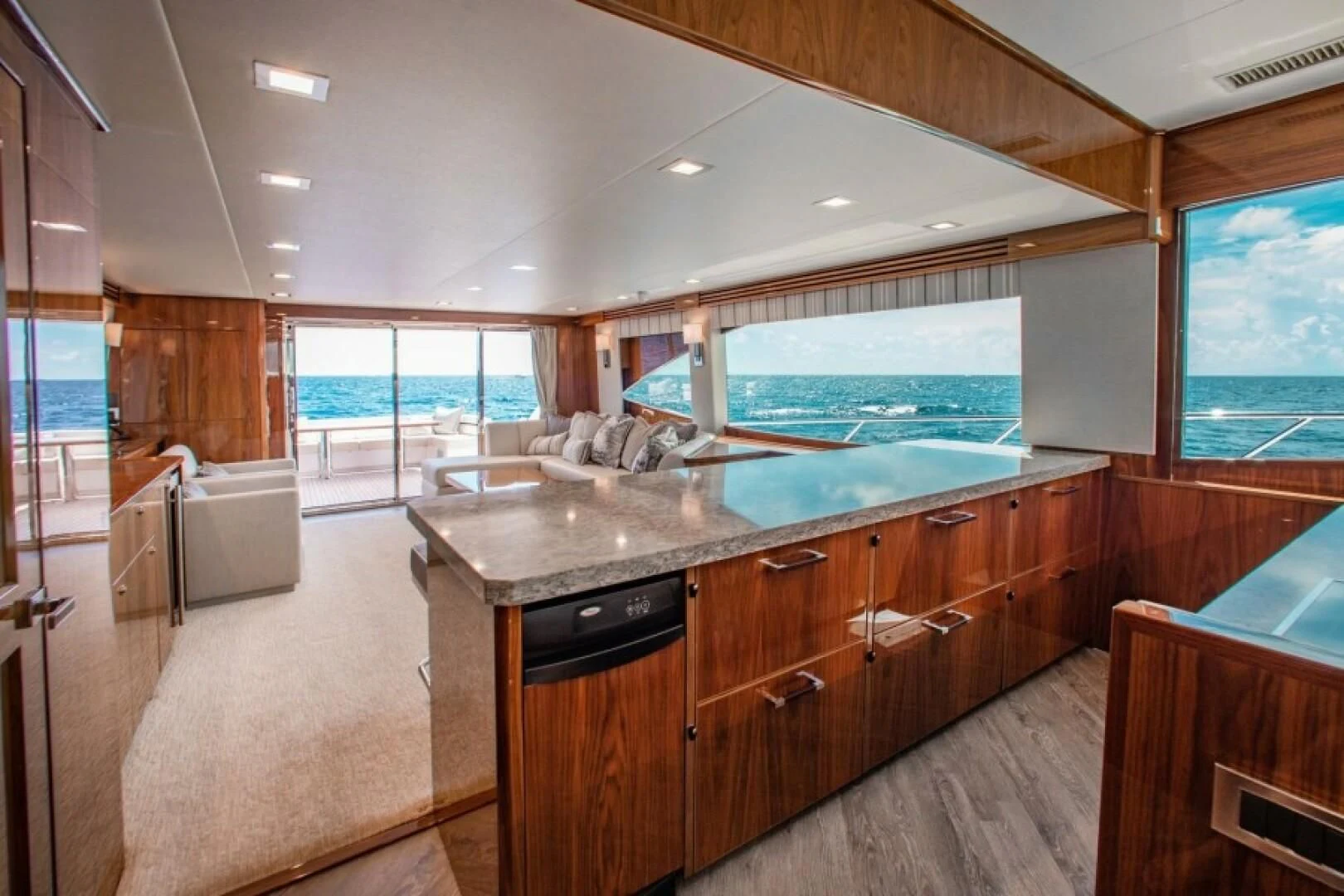 a large kitchen with a large island aboard MANA Yacht for Sale