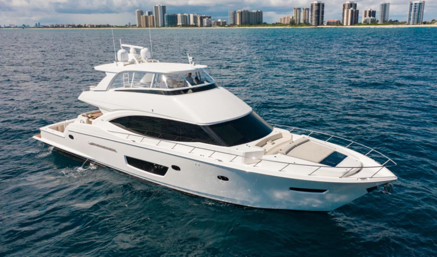 a white yacht in the water aboard MANA Yacht for Sale
