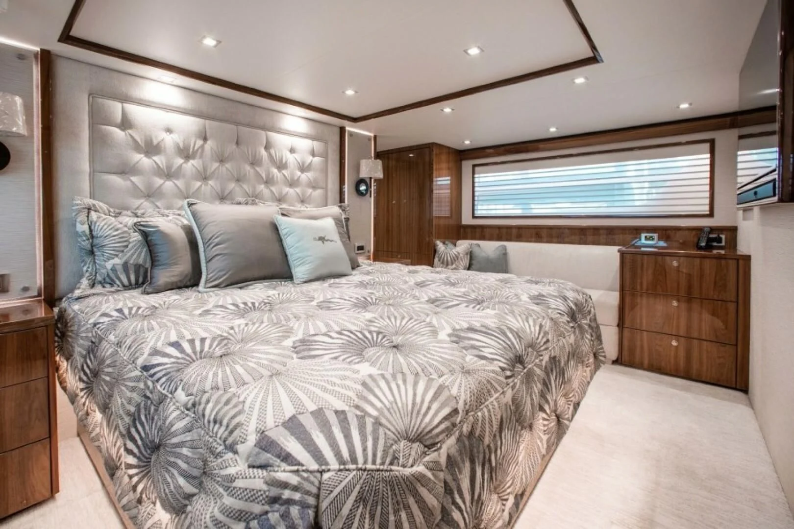 a large bed in a room aboard MANA Yacht for Sale