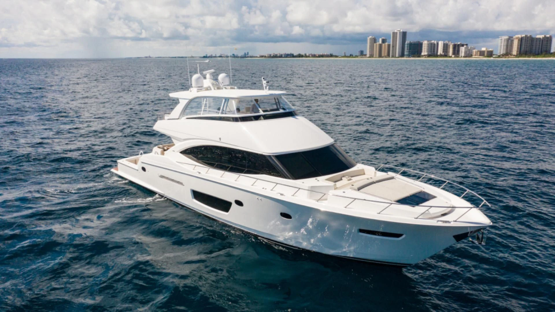 a white yacht in the water aboard MANA Yacht for Sale
