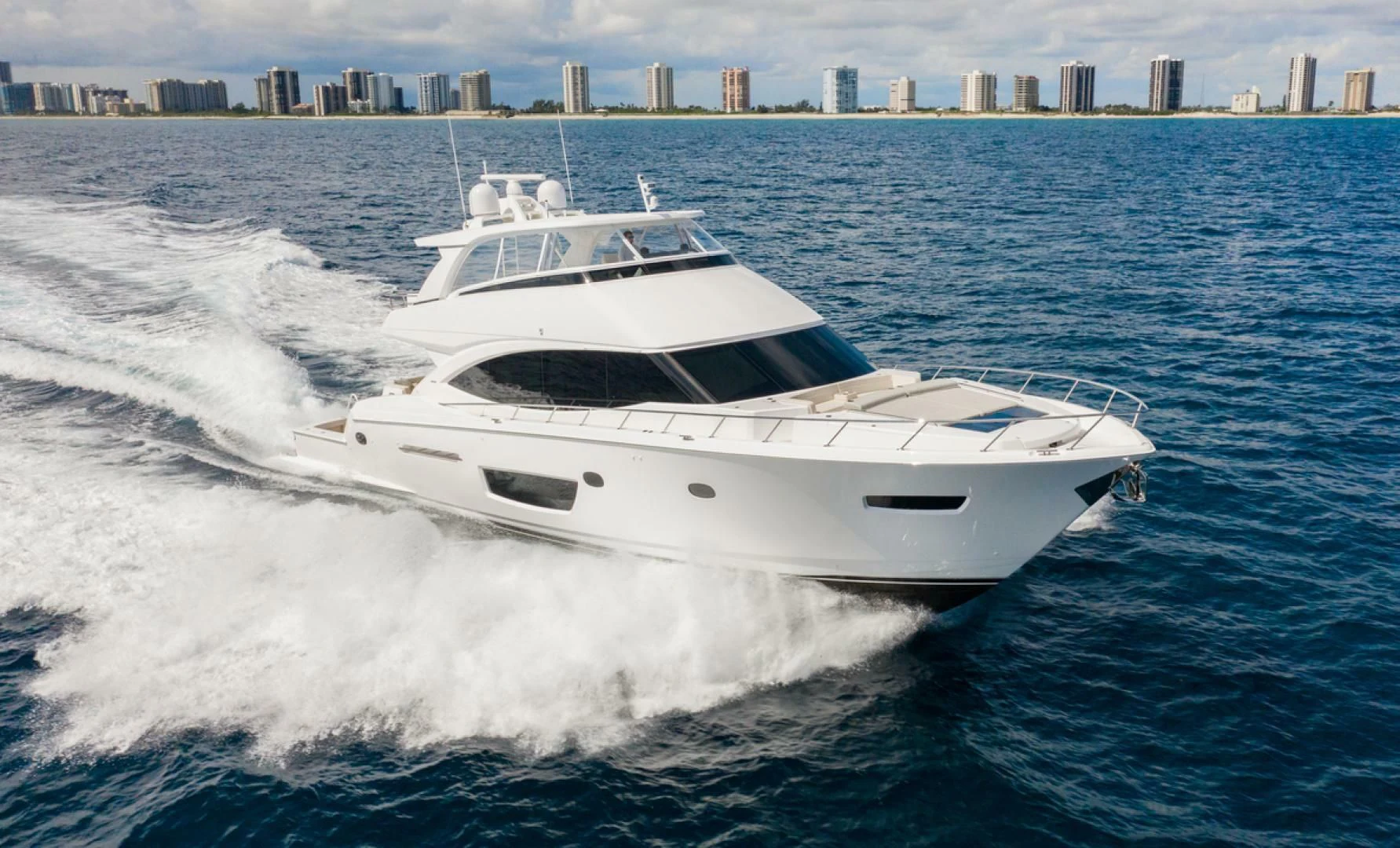 a white yacht on the water aboard MANA Yacht for Sale