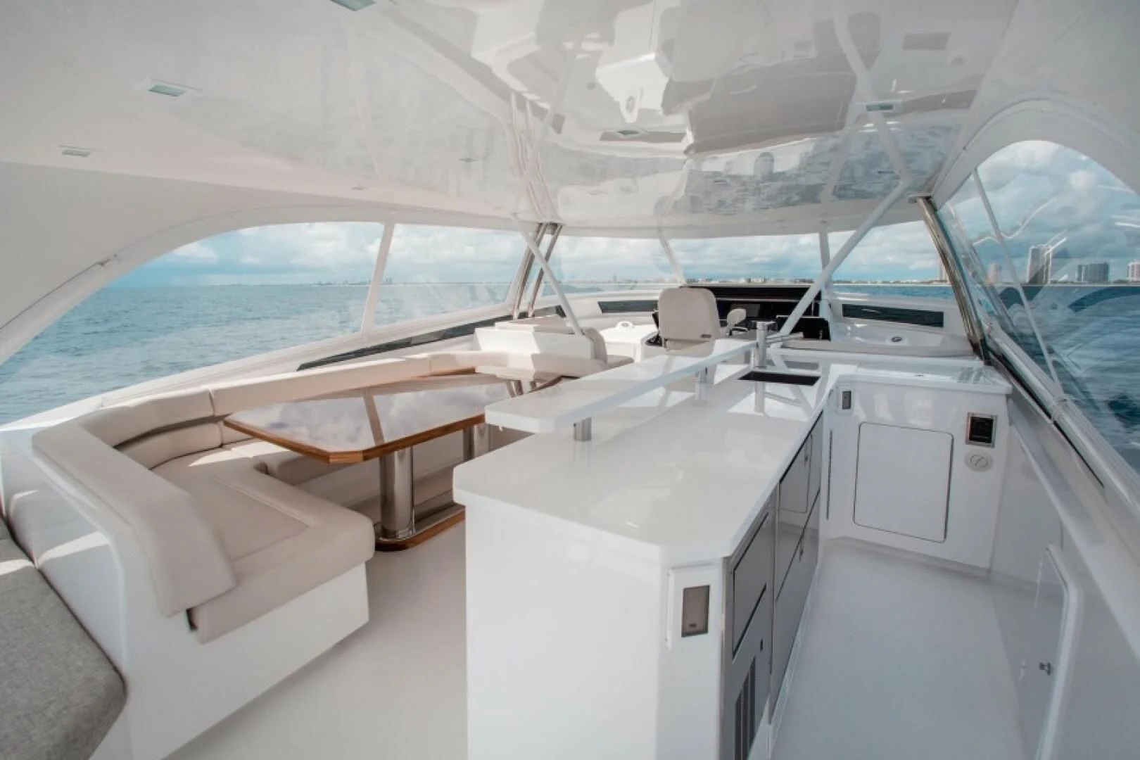 a boat with a desk and chairs aboard MANA Yacht for Sale