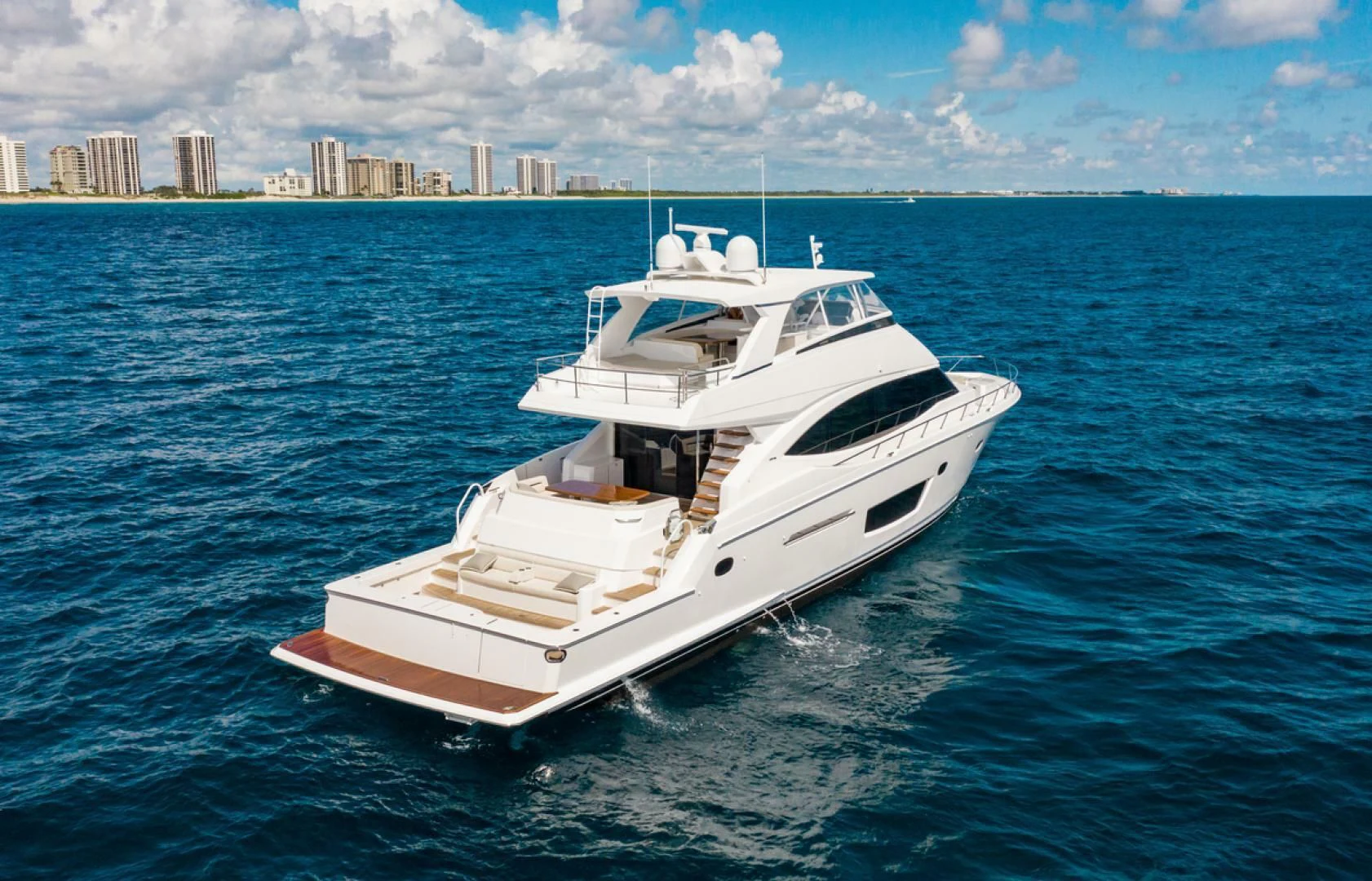 a white boat in the water aboard MANA Yacht for Sale