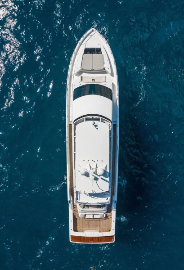 a white ship in the water aboard MANA Yacht for Sale