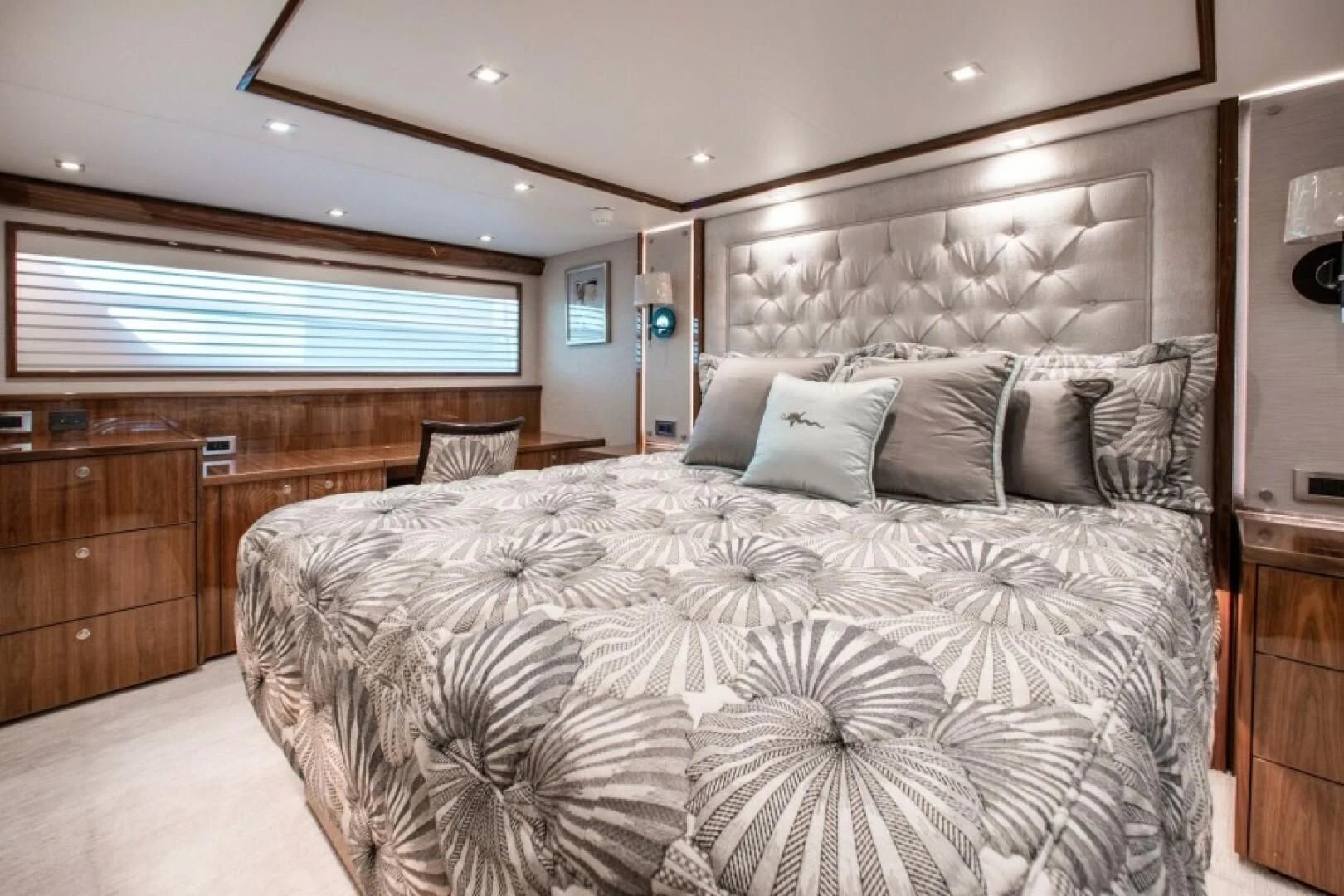 a bedroom with a large bed aboard MANA Yacht for Sale