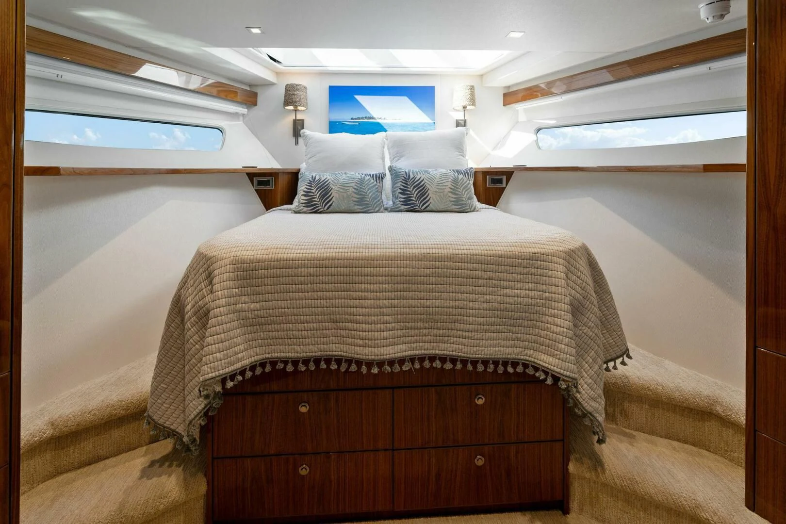 a bed with a wooden frame aboard MANA Yacht for Sale