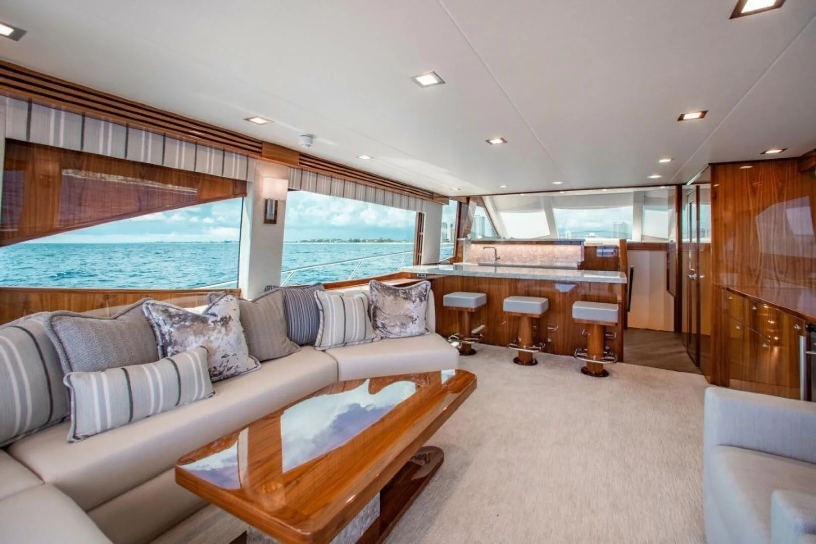 a living room with a large window aboard MANA Yacht for Sale