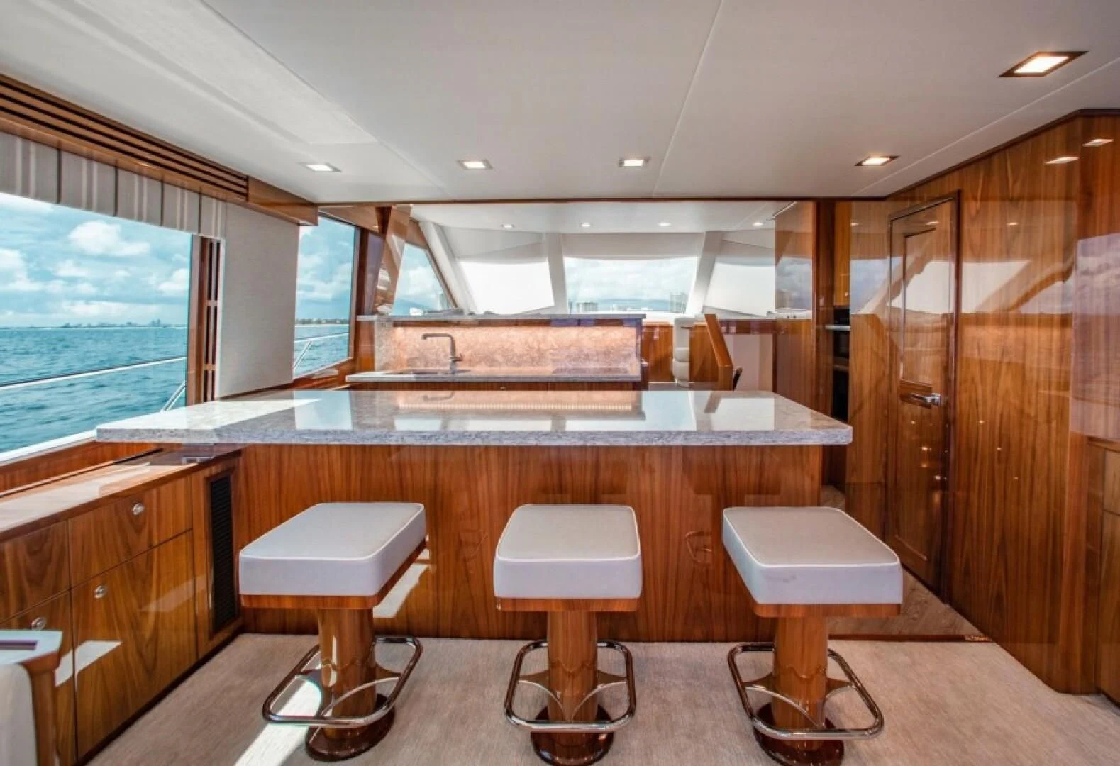 a room with stools and stools aboard MANA Yacht for Sale