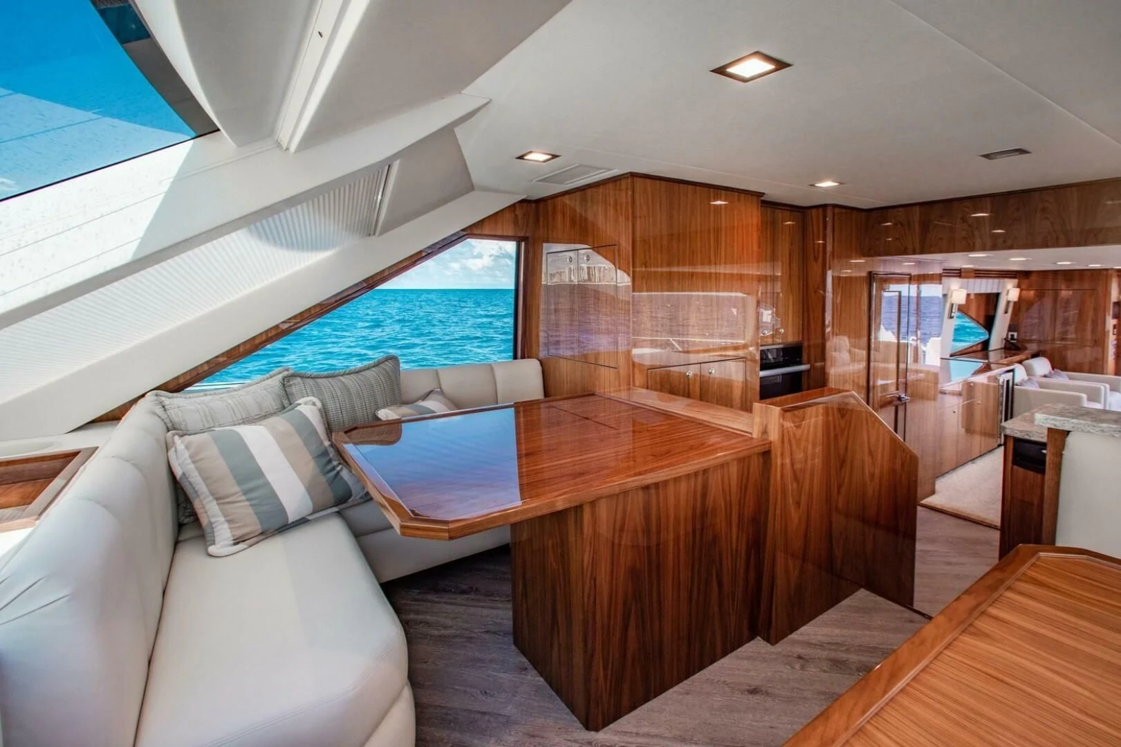 a living room with a large window aboard MANA Yacht for Sale