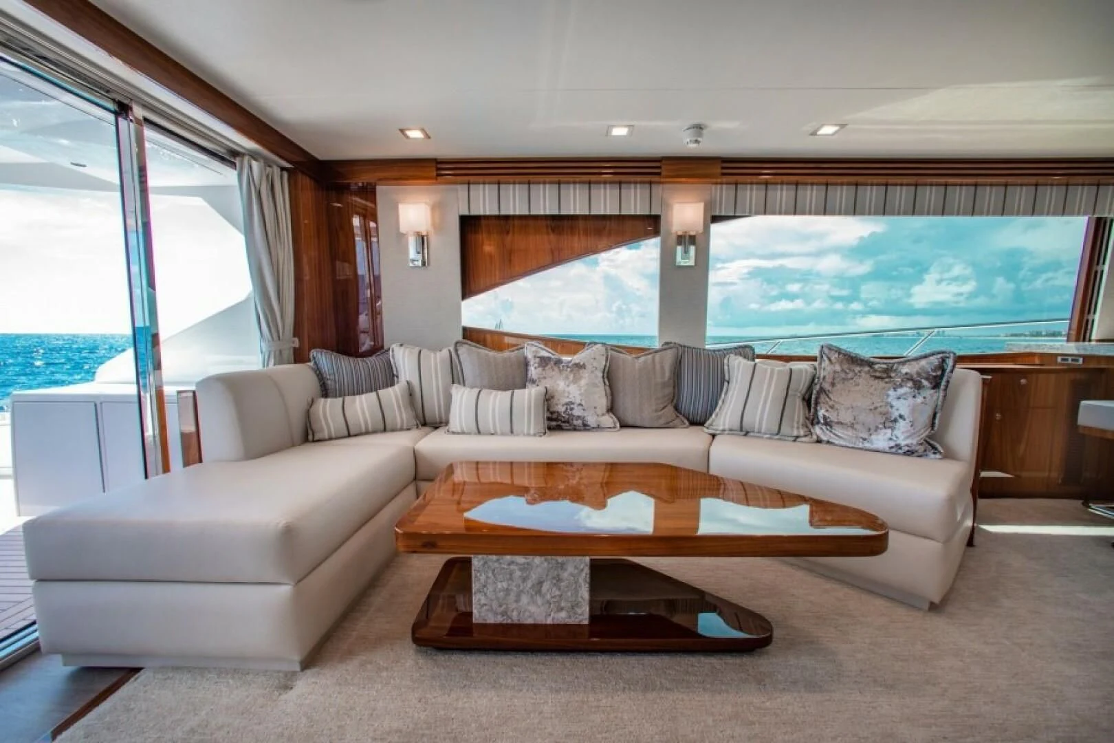 a living room with a large window aboard MANA Yacht for Sale