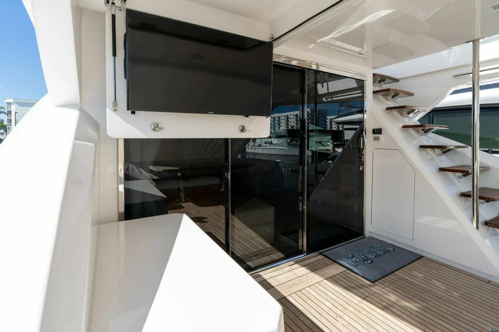 a large room with a large black screen and a large black rectangular object aboard MANA Yacht for Sale