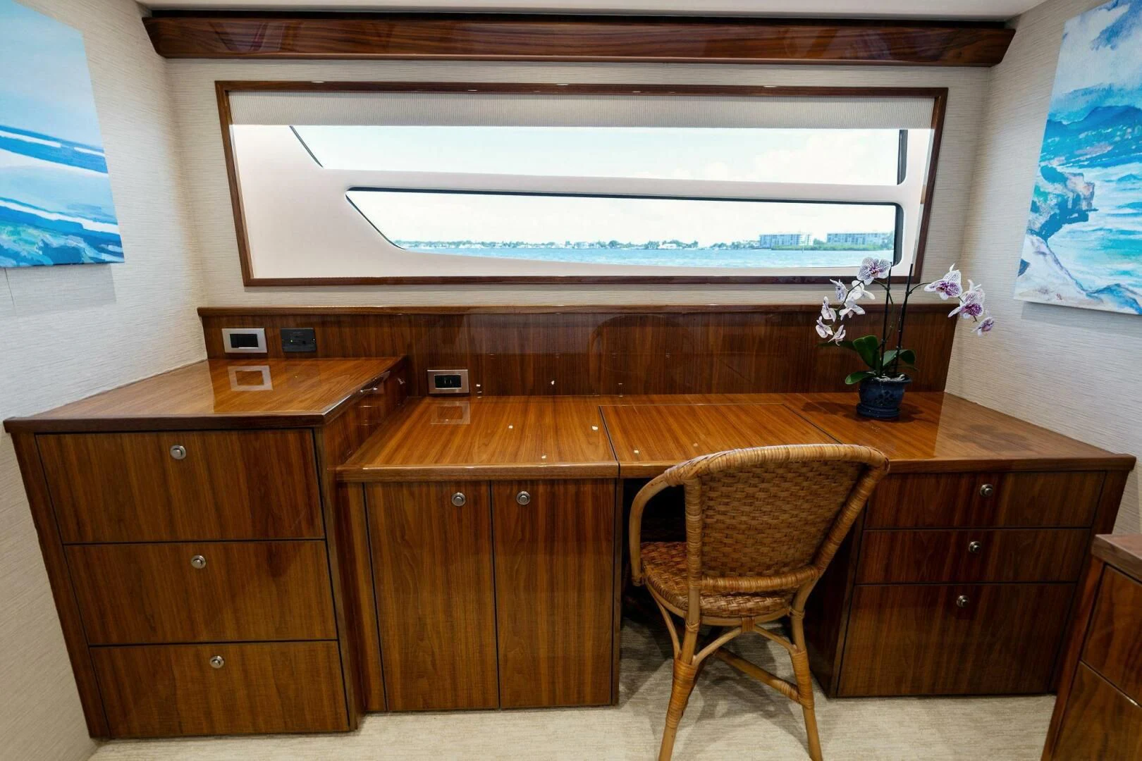 a room with a desk and a large tv aboard MANA Yacht for Sale