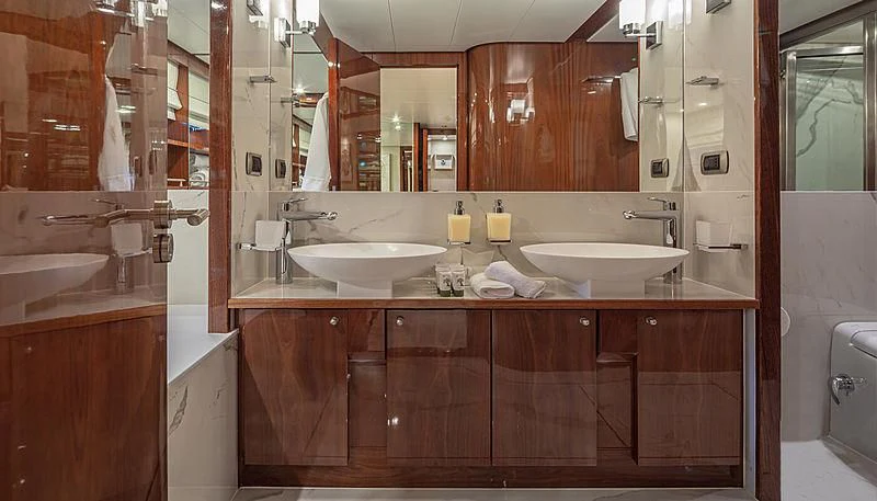 a bathroom with a sink and a mirror aboard GRACE Yacht for Sale