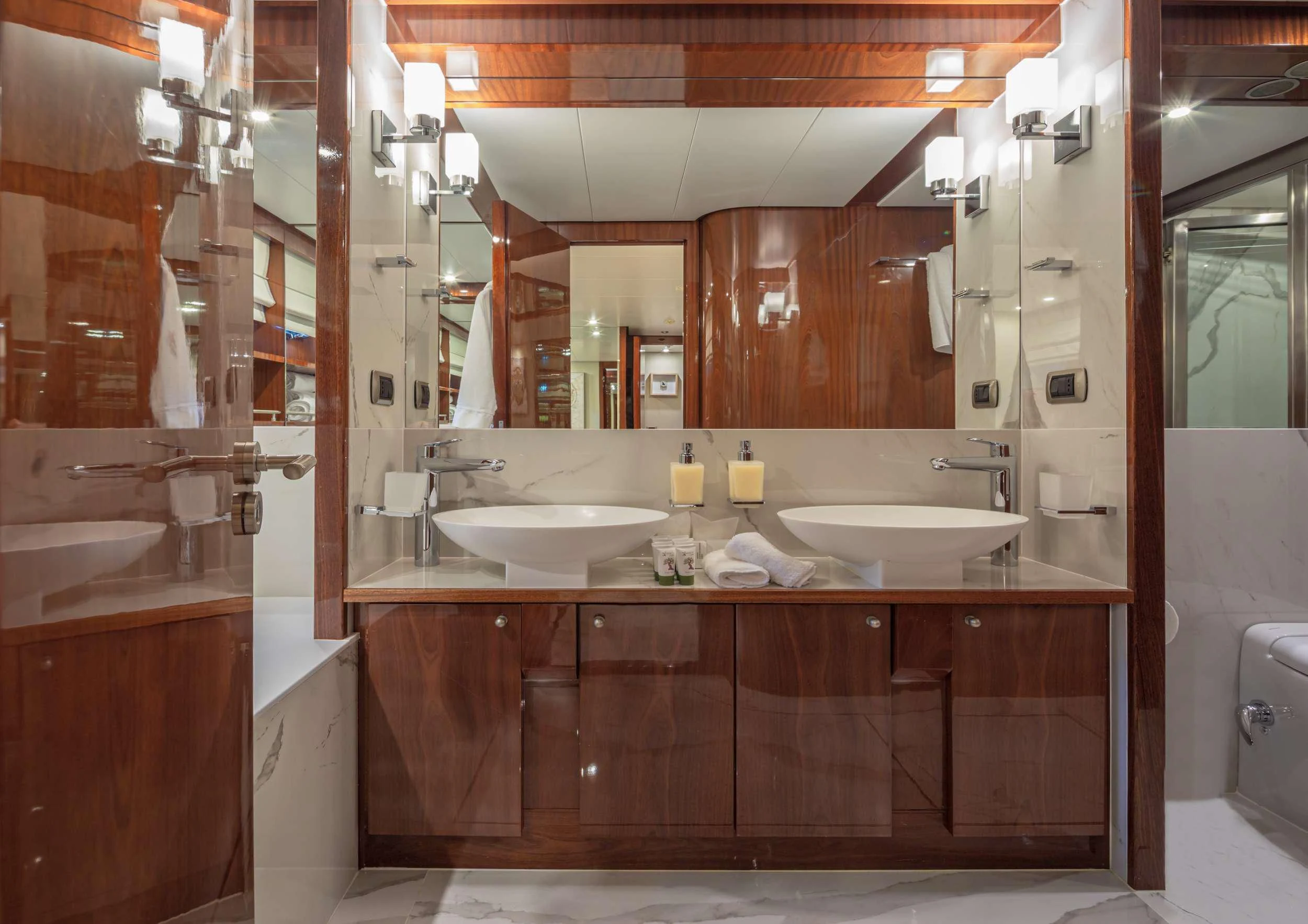 a bathroom with a sink and a mirror aboard GRACE Yacht for Sale