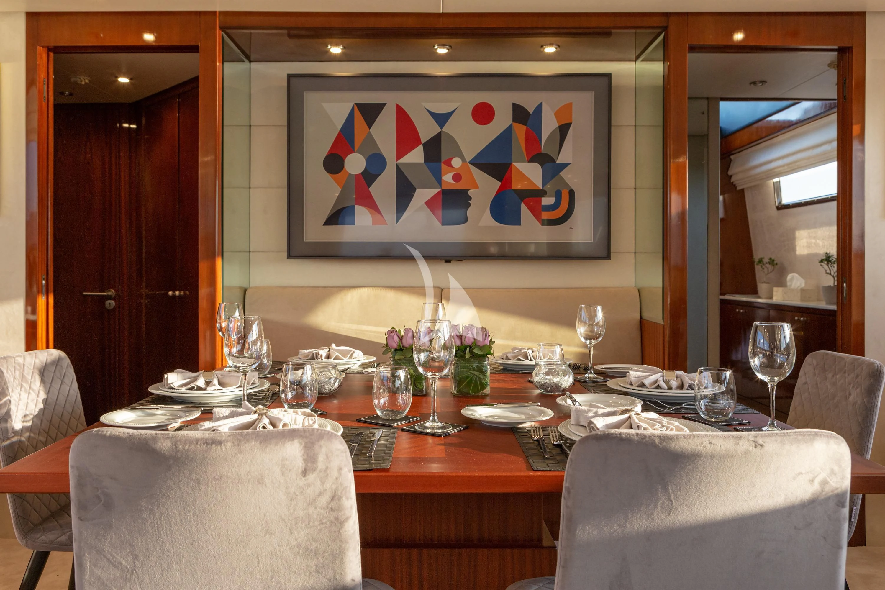 a table with plates and glasses on it aboard GRACE Yacht for Sale