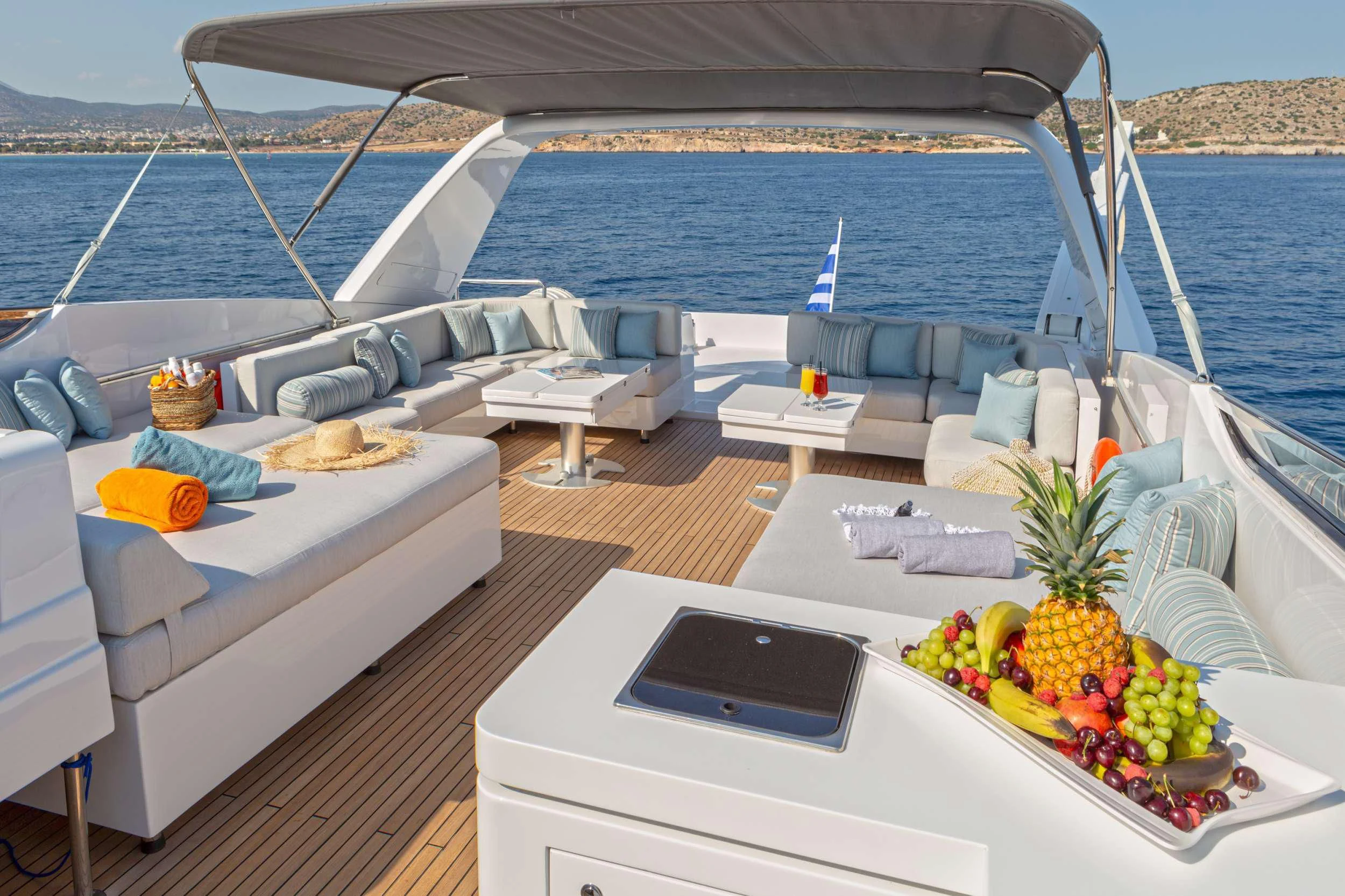 a deck with a pool and a laptop on it aboard GRACE Yacht for Sale
