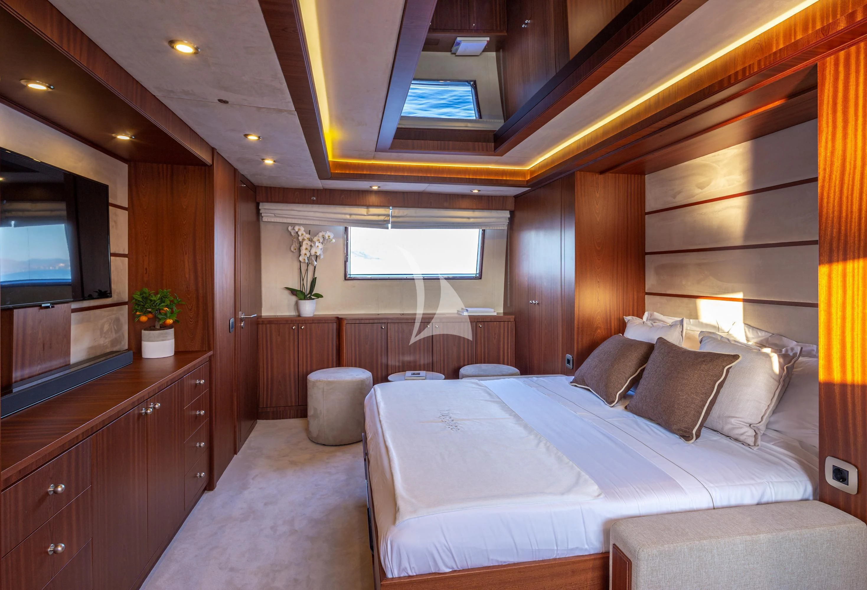 a room with a bed and a tv aboard GRACE Yacht for Sale