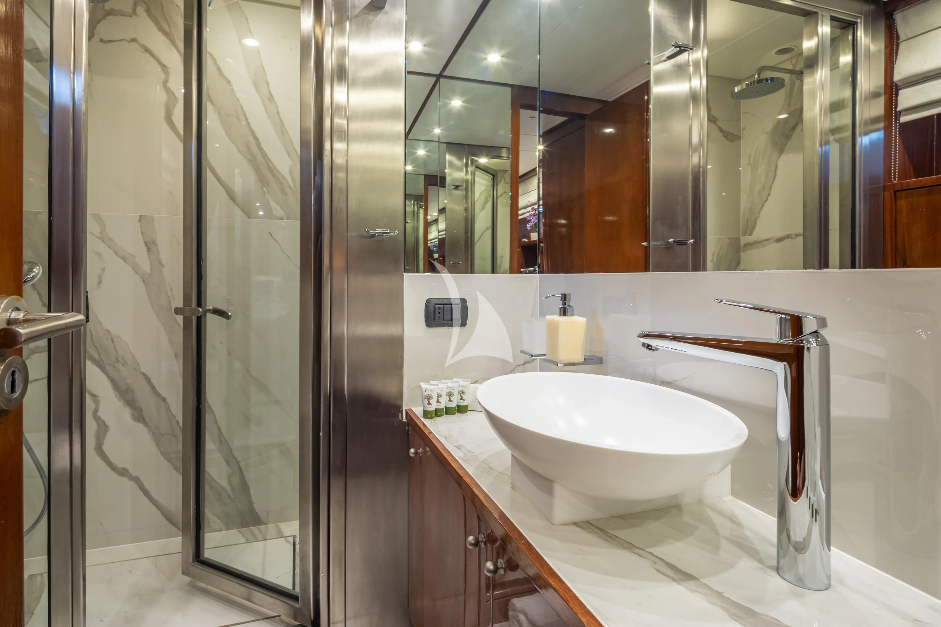 a bathroom with a sink and a mirror aboard GRACE Yacht for Sale