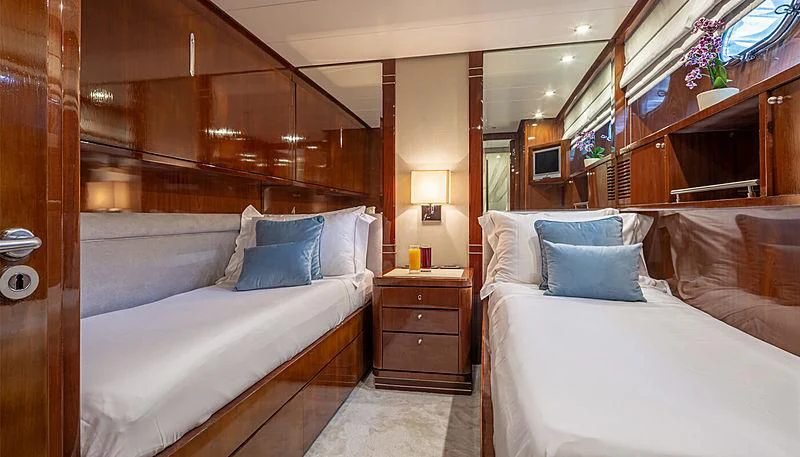 a room with two beds aboard GRACE Yacht for Sale