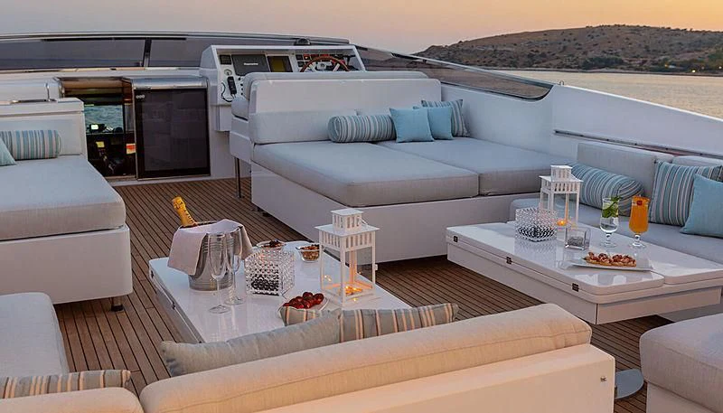 a living room with a couch and a table aboard GRACE Yacht for Sale