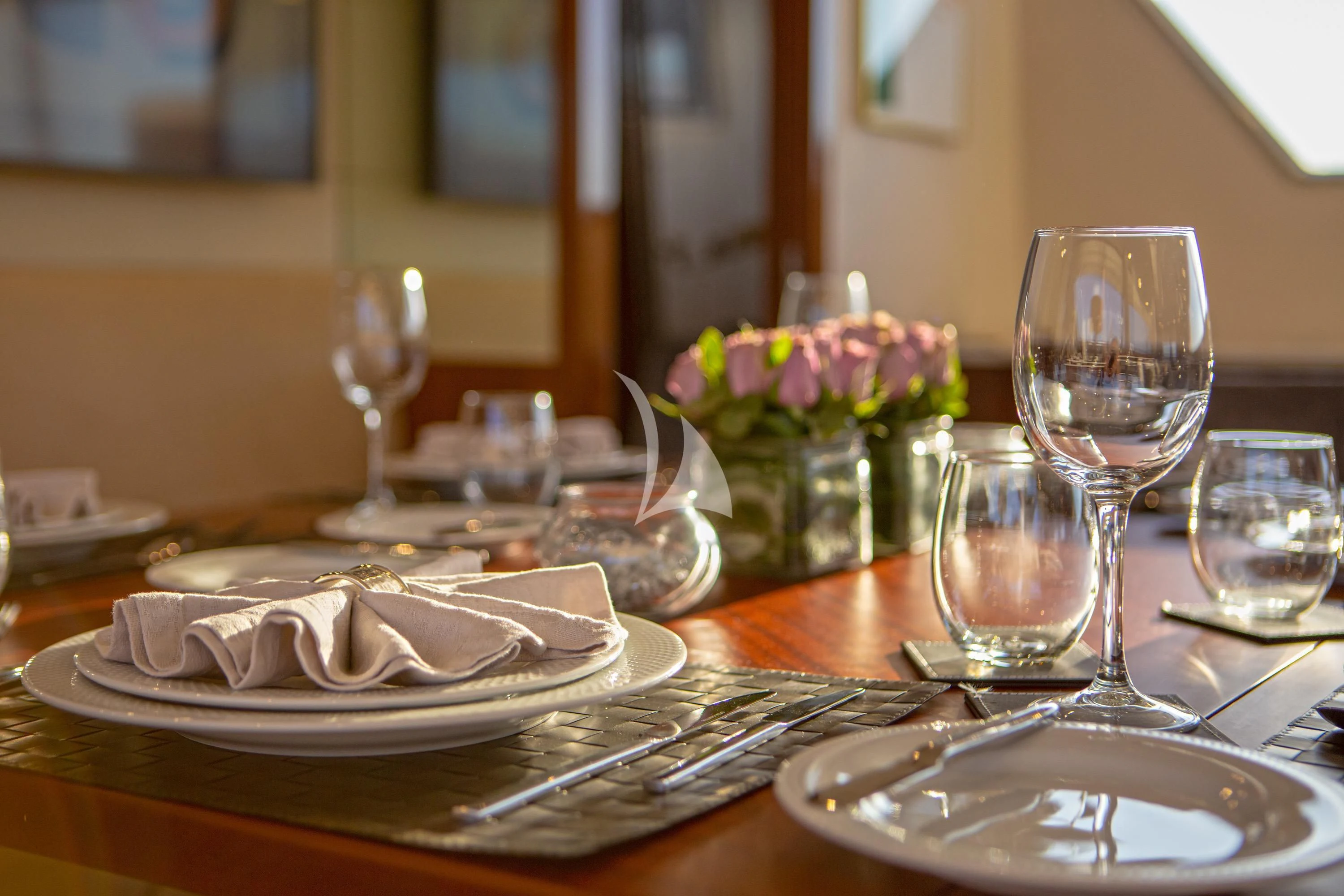 a candle on a table aboard GRACE Yacht for Sale