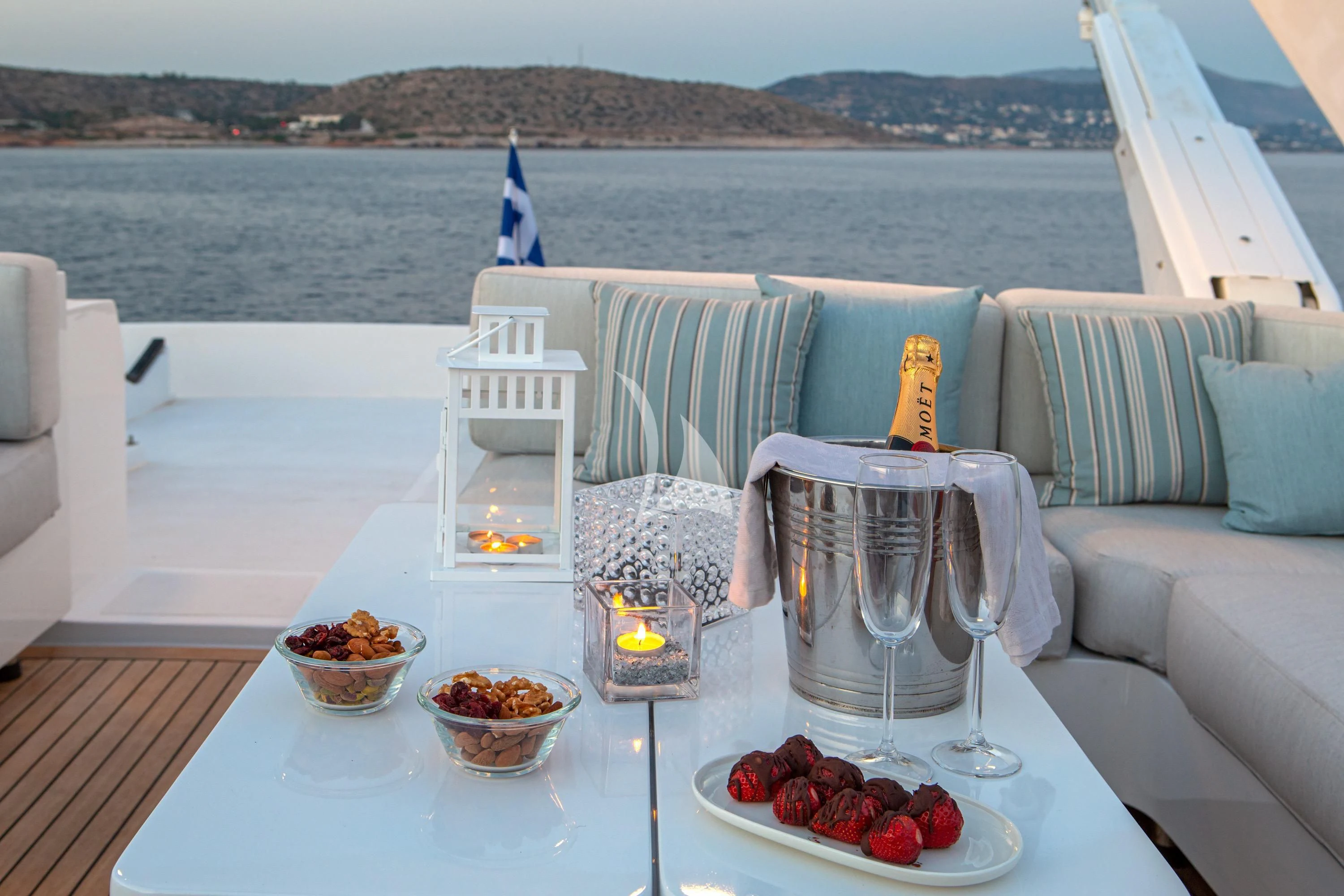 a table with food and glasses on it aboard GRACE Yacht for Sale